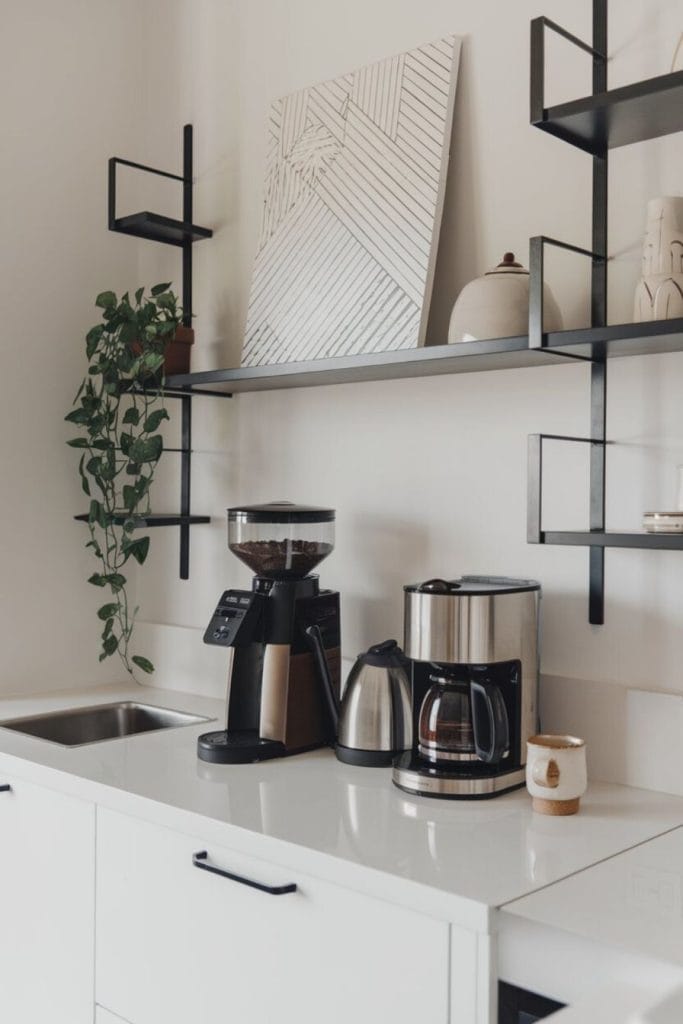 Modern home coffee bar setup with coffee maker and cups