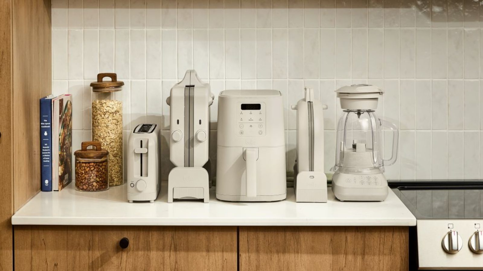 Assorted small kitchen appliances including air fryer, blender, and toaster on a countertop