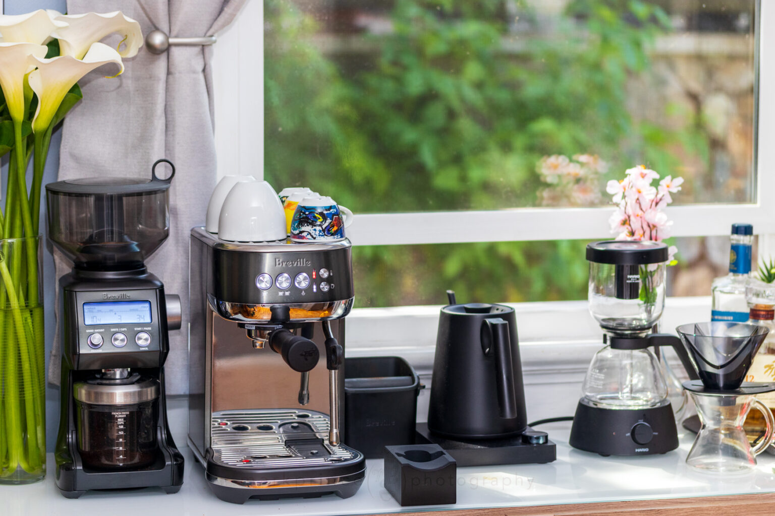 Home coffee bar setup featuring Breville Smart Grinder Pro and espresso cups ready for brewing