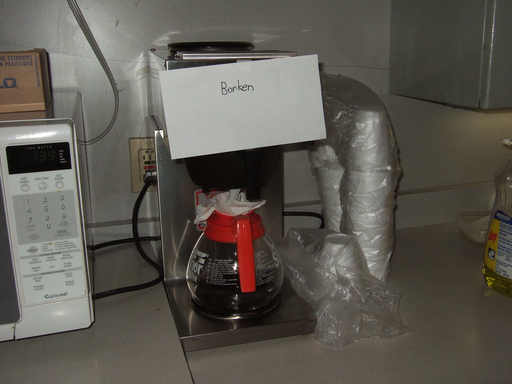 Old coffee maker showing wear compared to the cost of replacement