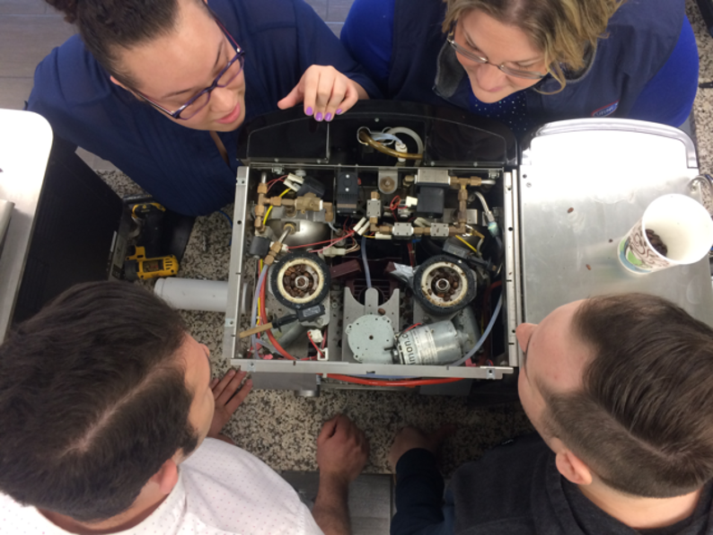 Internal water pathways inside a coffee maker affected by residue and mineral buildup