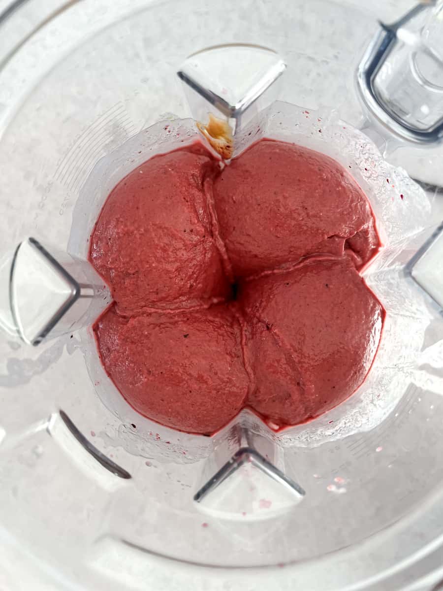 Very thick berry smoothie stuck in a blender jar with no vortex, causing motor strain