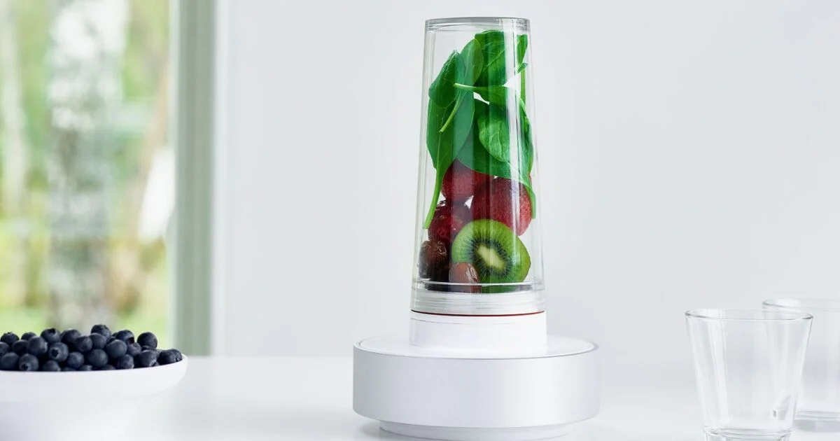 Blender jar stored upright on the counter with ingredients inside, showing proper storage position.