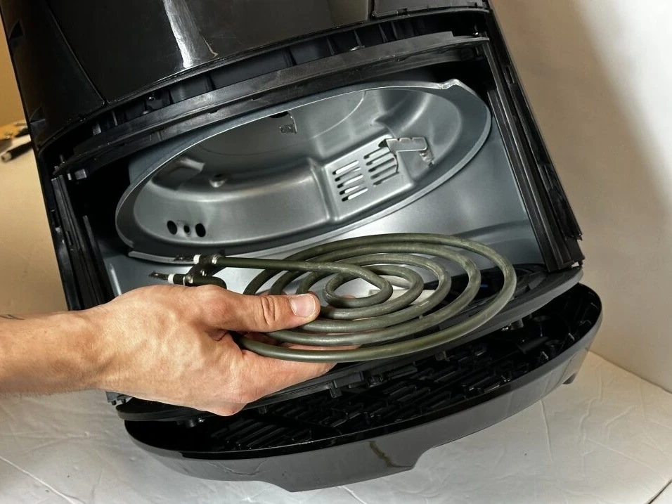 Heating element coil inside an air fryer showing where heat is generated during cooking